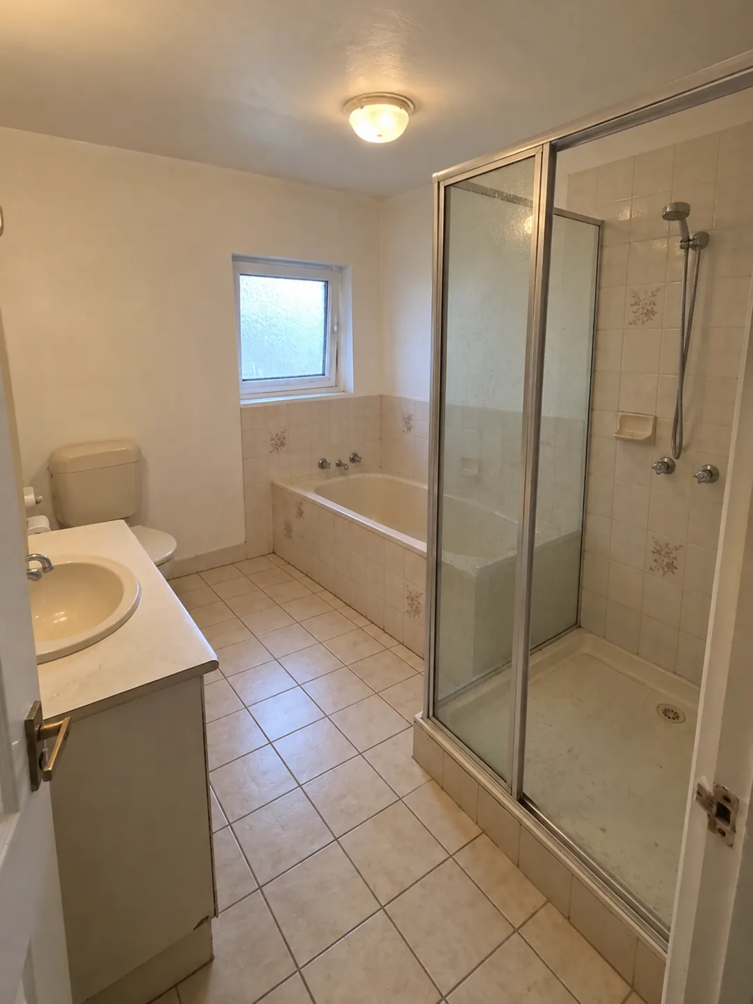 Before: illustrative image of a dated bathroom prior to renovation
